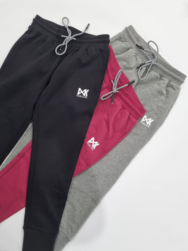 Three Colourways of Women's Slim Sweats: Black/Maroon/Grey as Flat Lays