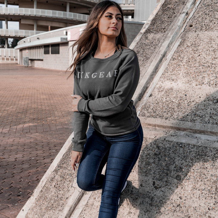 IXK Gear Crewneck Jumper in Colour: Charcoal. Concrete background.