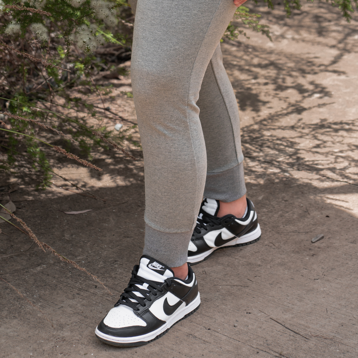 IXK Gear Cropped Trackies in Colour: Grey. Cuffed ankles. Natural background.