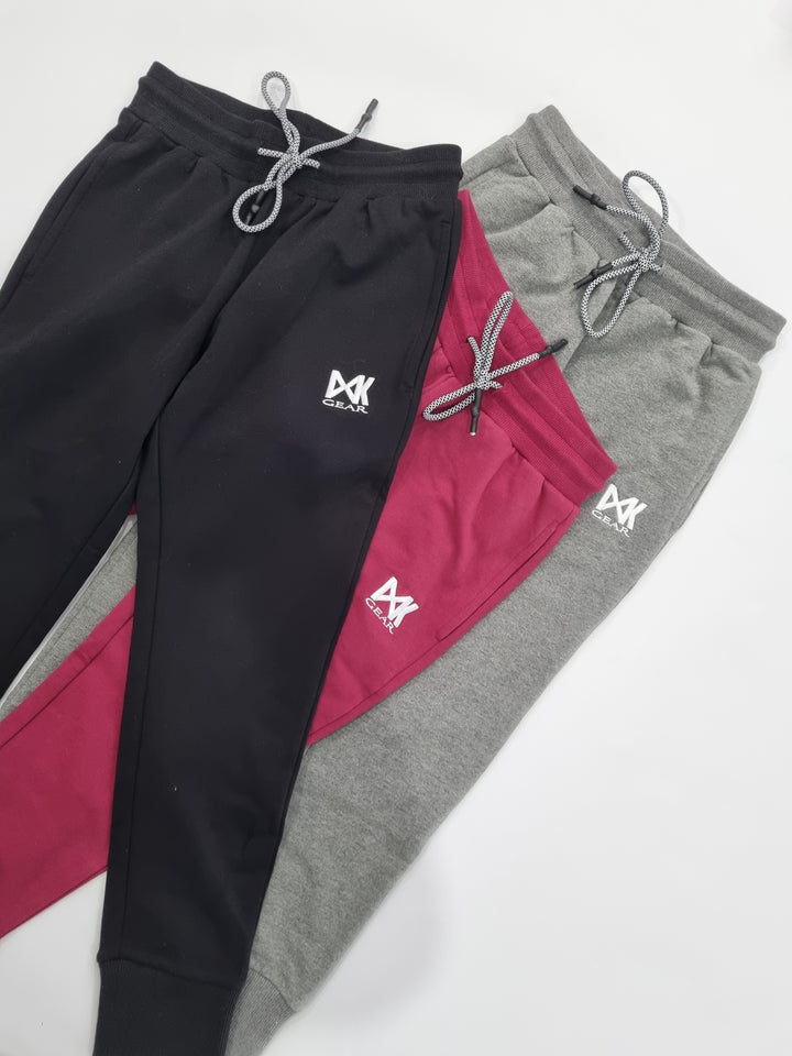 Three Colourways of Women's Slim Sweats: Black/Maroon/Grey as Flat Lays